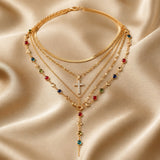 Parure di collana e orecchini in oro bianco con pietre multicolori