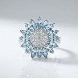 Elaro™ - Anello a Fiore in Argento con Topazio Blu