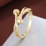 Anello incrociato in oro bianco con zirconi