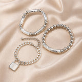 Collezione di Braccialetti con Perle in Oro Bianco e Chiusura Stile Punk