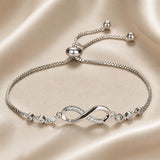 Bracciale scorrevole con simbolo dell'infinito in oro bianco