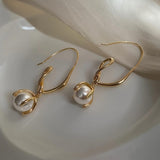 Orecchini a Goccia di Perla con Anello Twist