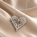 Collana con ciondolo in oro bianco e cuore in zirconia