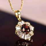 Collana con pendente floreale in oro e rubino