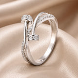 Anello incrociato in oro bianco con zirconi