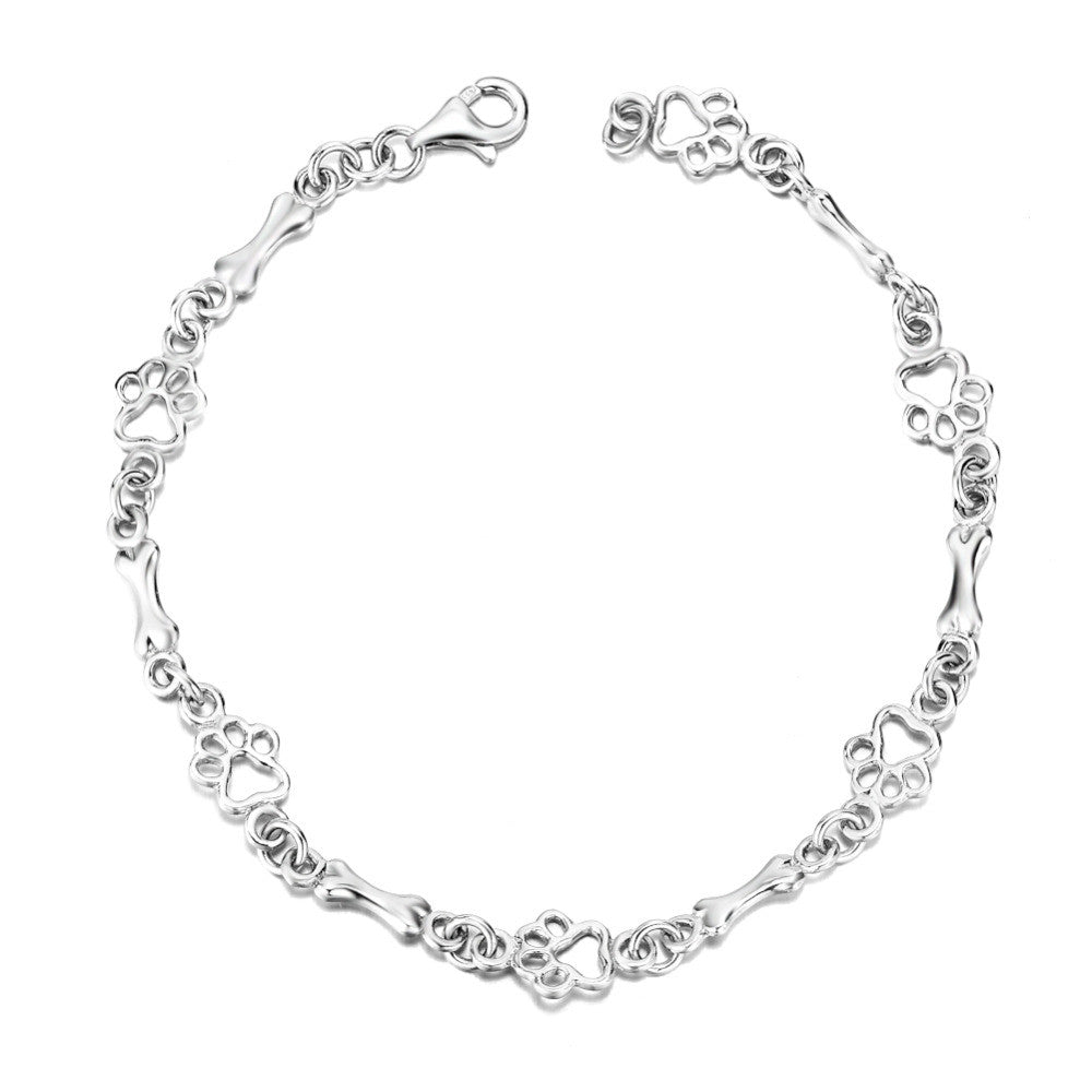 Pulsera de plata pura de edición limitada con dije de pata y hueso de perro