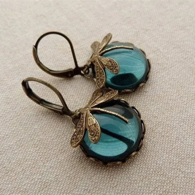 Pendientes esféricos con forma de libélula en oro antiguo