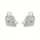 Aretes de puño en plata y oro de dos tonos