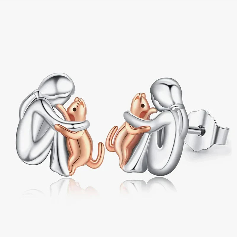 Pendientes con forma de abrazo de gato en plata y oro bicolor