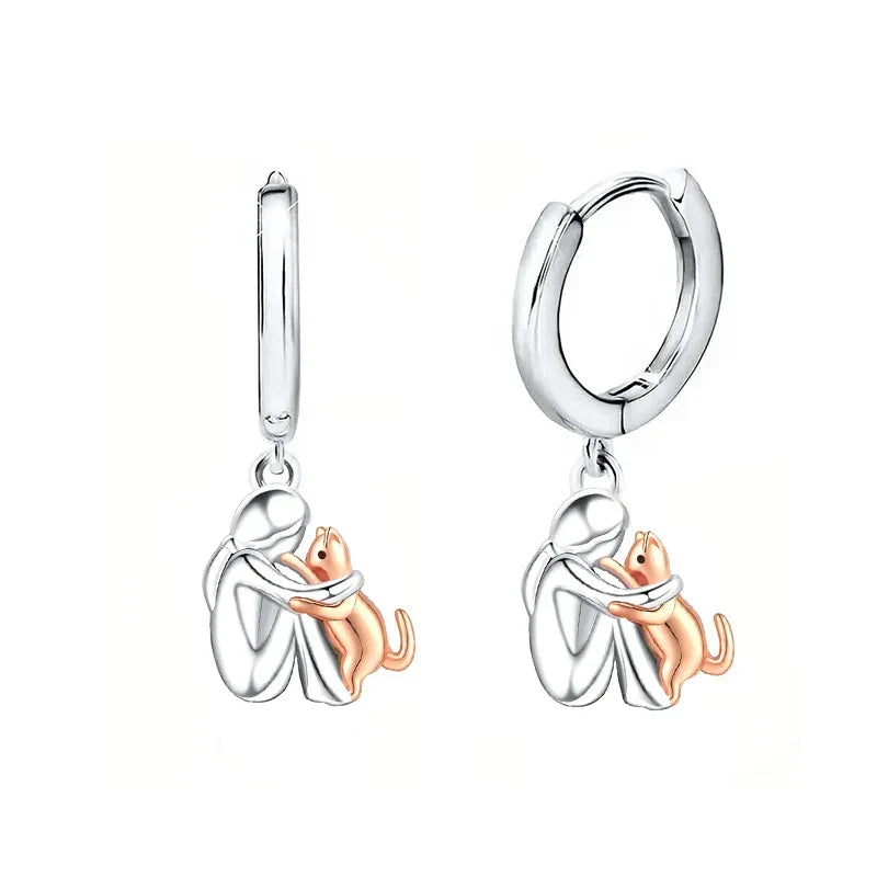 Pendientes con forma de abrazo de gato en plata y oro bicolor