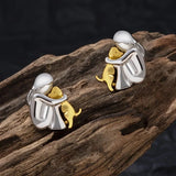 Aretes de puño en plata y oro de dos tonos