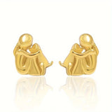 Aretes de puño en plata y oro de dos tonos