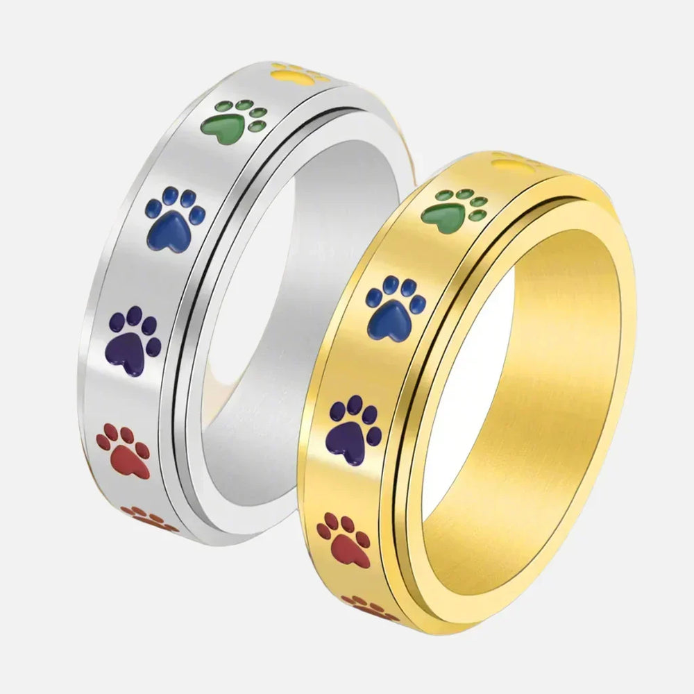 Anillo giratorio para aliviar el estrés: acero inoxidable con patas de arcoíris