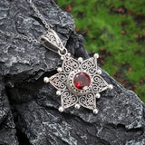 Collana con pendente a stella in argento e rubino