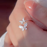 Anello in oro bianco con doppia farfalla di zirconia