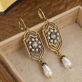 Orecchini Vintage con Perle Incastonate in Oro