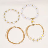 Set di 4 Bracciali Impilabili con Perle e Margherite