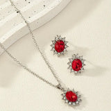 Set di gioielli in argento e rubino floreale