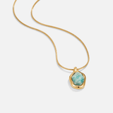 Collana con pendente in acquamarina dorata