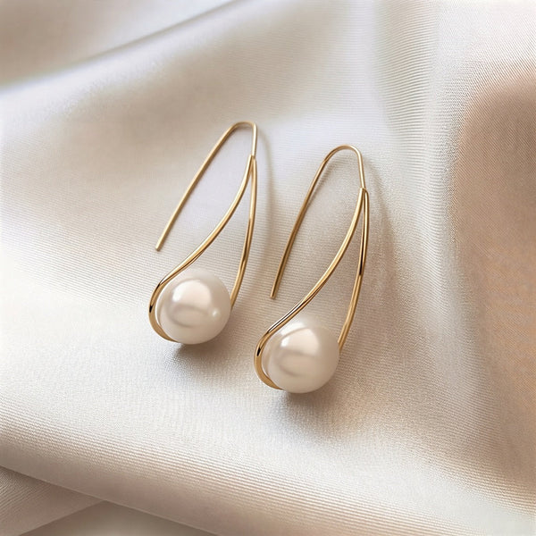 Elegantes aretes místicos con perlas